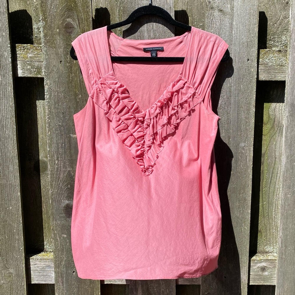 Peach ruffle front sleeveless top